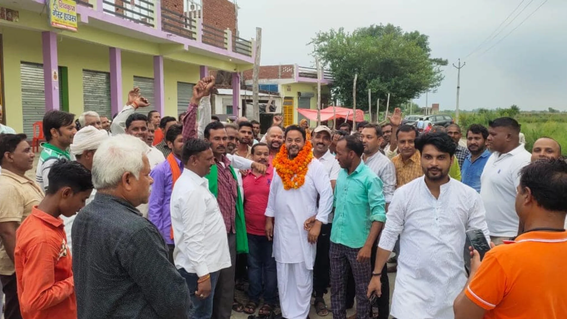 Dr. Arvind Gupta with supporters during village outreach